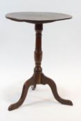 A late 19th century mahogany tilt top table, on turned pedestal and cabriole legs,