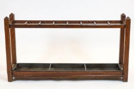 A pitch pine stick stand, of rectangular section, with lead liner,