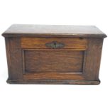 An oak small rectangular Collector's cabinet, the hinged fall front panelled lockable front,