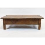 A pine kitchen table, adapted as a Country coffee table, of rectangular form,