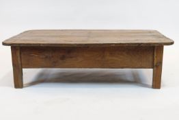 A pine kitchen table, adapted as a Country coffee table, of rectangular form,