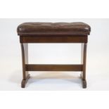A Wurlizter wooden piano stool, 20th century, with hinged leatherette seat,