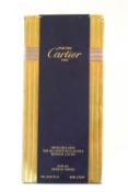 A Must de Cartier refillable purse natural spray in gilt with original fitted box