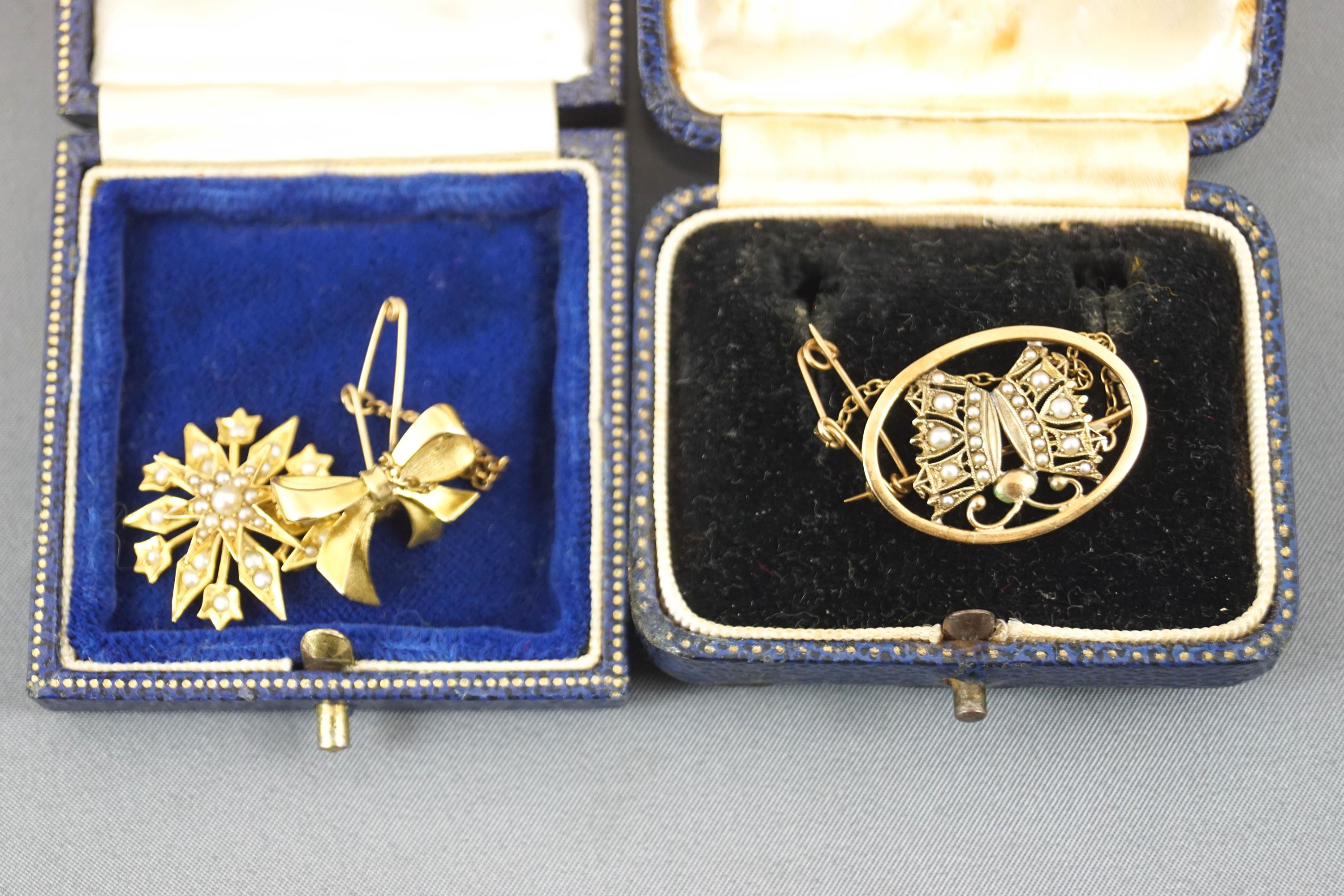 A collection of two brooches