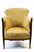 An Edwardian tub shaped armchair,