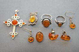 A collection of silver and reconstructed amber jewellery