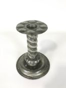 A Norwegian (NEA TINN) arts and crafts pewter candlestick, the spiral stem missing a broad nozzle