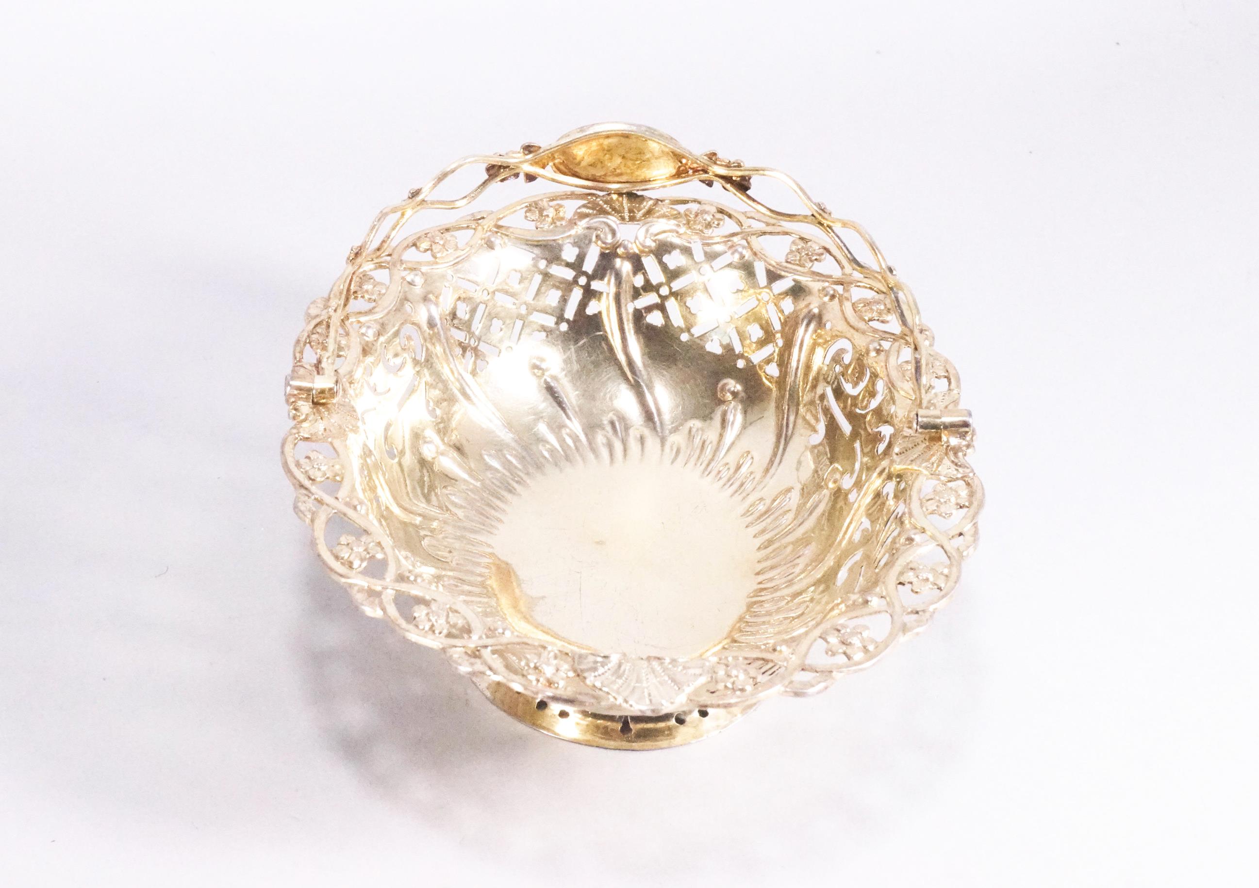 A small silver gilt sweetmeat basket of oval form with pierced panel body - Image 2 of 2