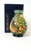 A Moorcroft pottery baluster vase decorated with the Trout pattern, impressed factory marks,