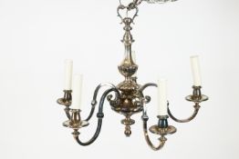 A continental white metal chandelier,the baluster graduated stem issuing four S shaped branch,