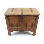 An Indian iron bound teak wood dowry chest, with hinged top above a frieze drawer,