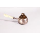 A small silver brandy pan, of plain rounded bellied form with gilt interior and an ivory handle,