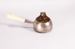 A small silver brandy pan, of plain rounded bellied form with gilt interior and an ivory handle,