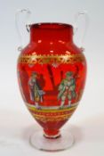 A Venetian style glass enamelled vase, oriform and of red tint, enamelled with 18th century style,