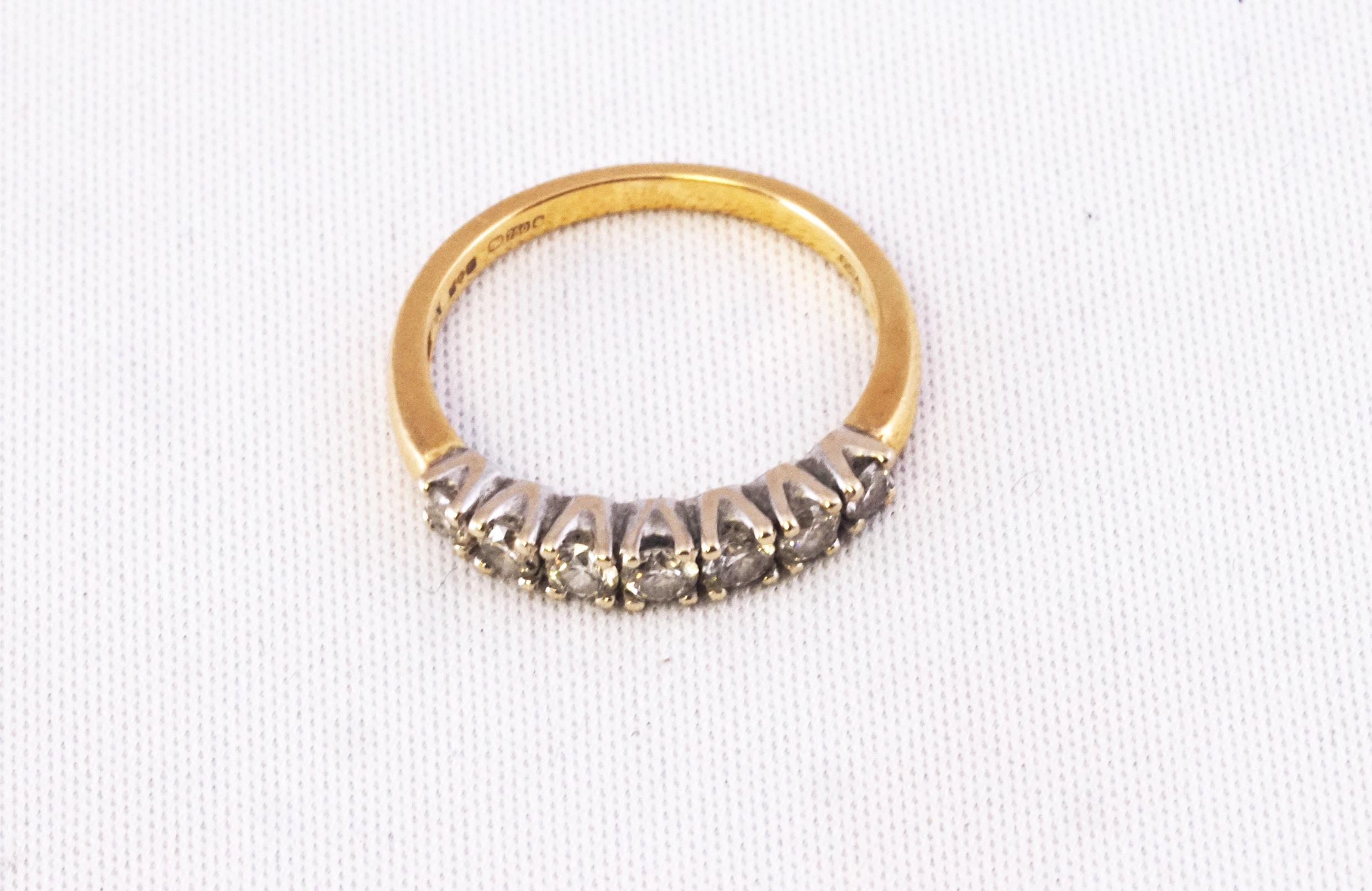 A yellow and white metal half hoop ring set with seven graduated round brilliant cut diamonds. - Image 2 of 2