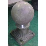 A pair of reconstituted stone plain ball finials on fluted trumpet square bases 66cm