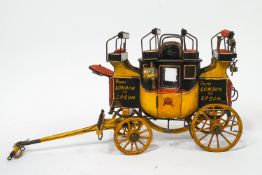 A model Royal Mail style Stage Coach, finished in black over yellow,