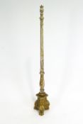 A giltwood and gesso column standard lamp base, in the style of a 19th century torchere on paw feet,