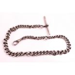 A white metal watch chain of graduated curb design having a swivel clasp and T-bar attachment.