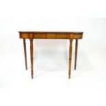 A 19th mahogany console table of D form with boxwood inlaid frieze on turned tapering legs,