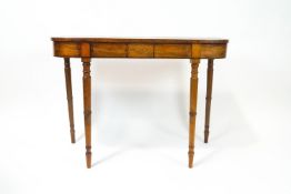 A 19th mahogany console table of D form with boxwood inlaid frieze on turned tapering legs,