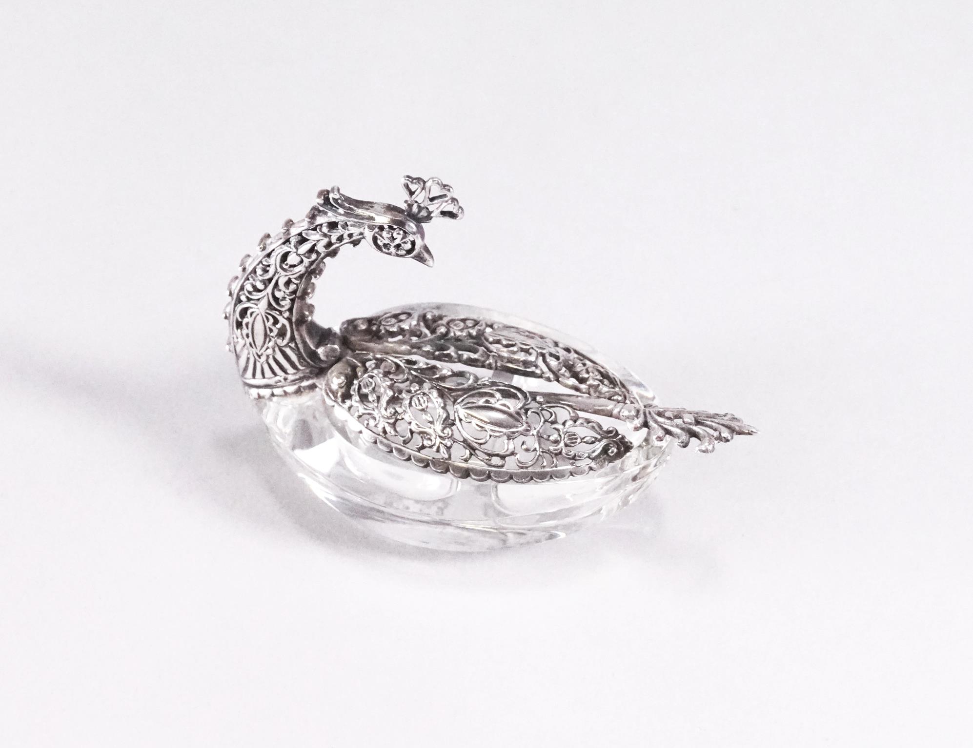 A pair of filigree white metal and glass table salts in the form of a swan with folding wings - Image 2 of 2