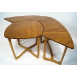 A set of Ercol sectional light elm occasional tables,