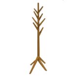 An oak coat stand, with eight branches on four splayed feet,
