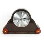 An eight day German (HAC) oak mantel clock, the chiming clock with Hermle floating balance movement,