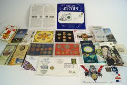 A collection of commemorative coins sets and medals, including a 1953 coronation coin,