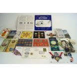 A collection of commemorative coins sets and medals, including a 1953 coronation coin,