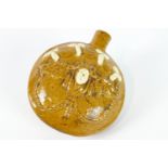 A Staffordshire pottery ochre glazed compressed circular flask, probably late 18th century,