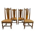 Set of four oak dining chairs with carved arched cresting rail above a carved solid splat