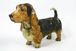 A earthenware sculpture model of a standing basset hound,by Kerry Jameson,2002,