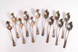 A cased set of six Hanoverian Rat Tail pattern silver teaspoons, Birmingham 1923,and another set,