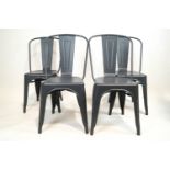 Four Xavier Pauchard model A metal chairs