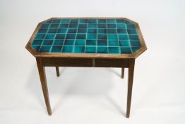 An oak kitchen table, of octagonal section,