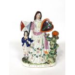 A Staffordshire pottery figure group of Band of Hope beside a tree trunk spill vase