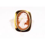 A yellow metal oval cameo set ring. Stamped 9ct gold. Size: N