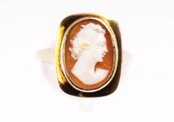 A yellow metal oval cameo set ring. Stamped 9ct gold. Size: N