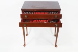 A mahogany two drawer canteen on cabriole legs,