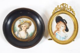 A hand painted miniature of a Gainsborough style lady contained in an oval gilt brass frame,