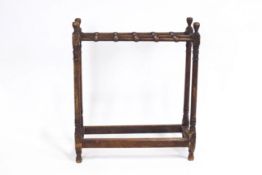 A mahogany turned stick stand,