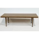 A Meredew teak coffee table, of rectangular section, on four tapering legs, circa 1960,