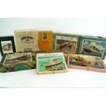 A collection of wooden jigsaw puzzles, to include various 'Victory' puzzles,