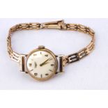 A gold cased Longines wristwatch, mechanical movement, fitted to a gate link bracelet,