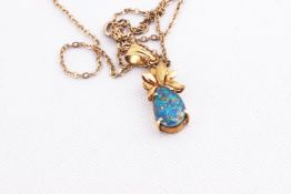 A yellow metal single stone pendant set with a pear shape opal triplet.