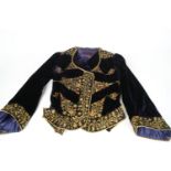 A collection of vintage clothing and textiles to include: an Edwardian brown velvet lady's jacket,