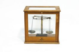 A set of laboratory scales by Becker's Sons, Rotterdam, in a case by Harris of B'ham,