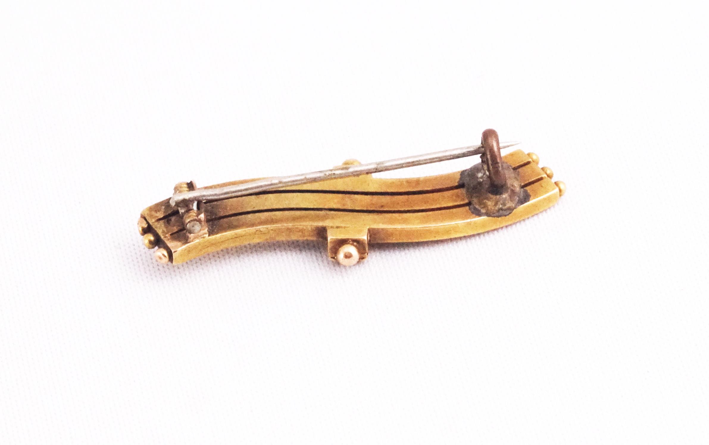 A yellow metal bar brooch with beaded design. Stamped 15ct. - Image 2 of 2